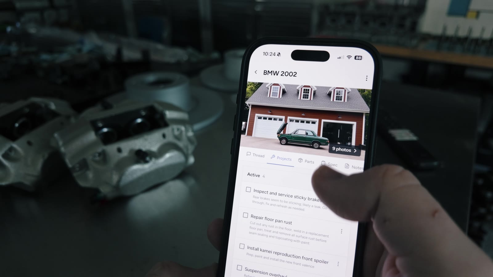 Assembly on an iPhone in the garage, showing projects for a BMW 2002
